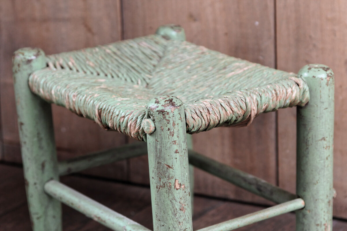 Old wooden and straw stool