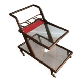 Rolling table made of wood, brass and glass