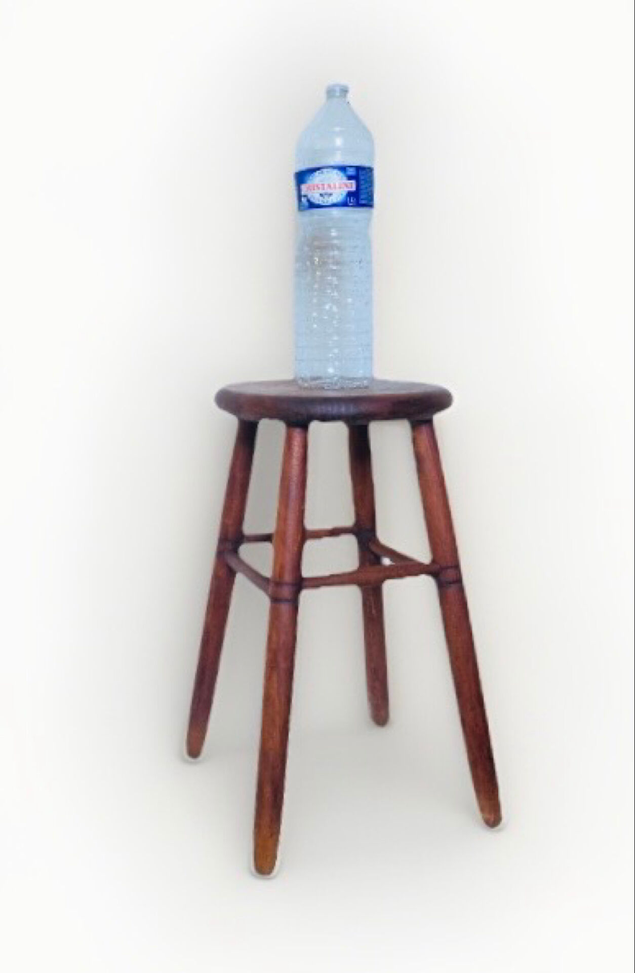 Vintage four-legged stool made of solid wood from the 1970s/80s.