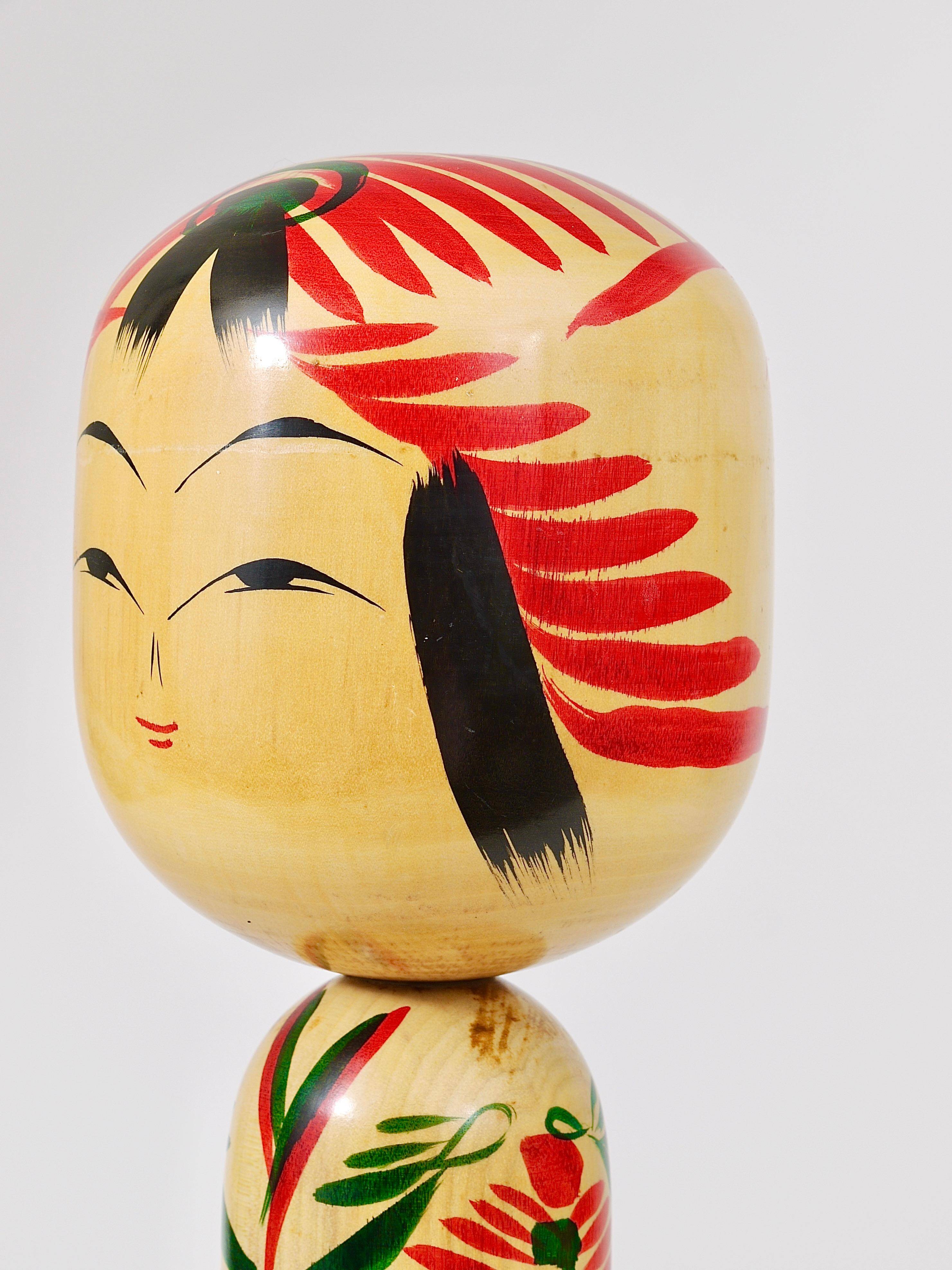 Decorative Kokeshi doll sculpture from northern Japan, hand-painted, signed.