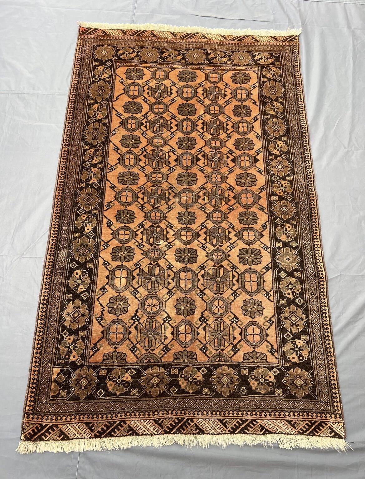 Old faded terracotta rug | Turkmen tribal wool rug
