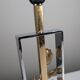Maison Charles table lamp in chrome and gilt bronze with rose, France, 1970s