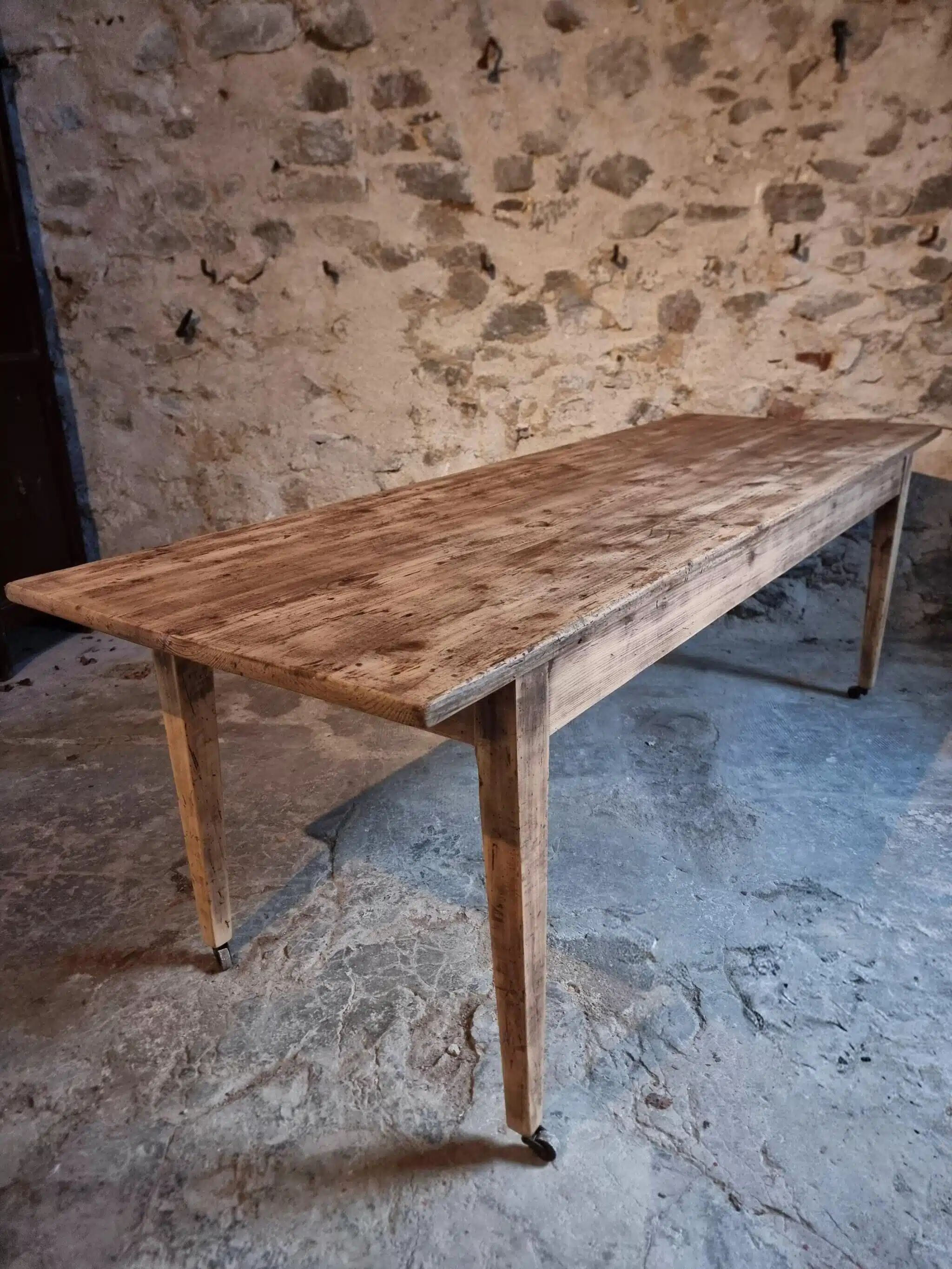 Antique French pine dining table, large farmhouse table on wheels, 19th century.