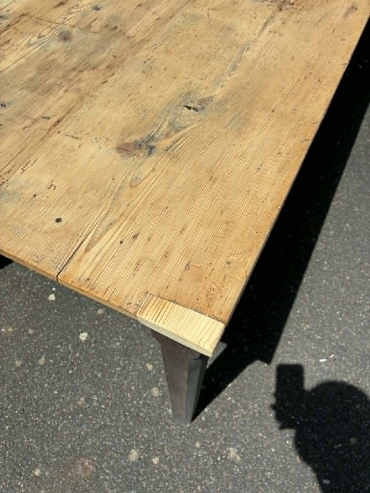 Black dining table in fir.