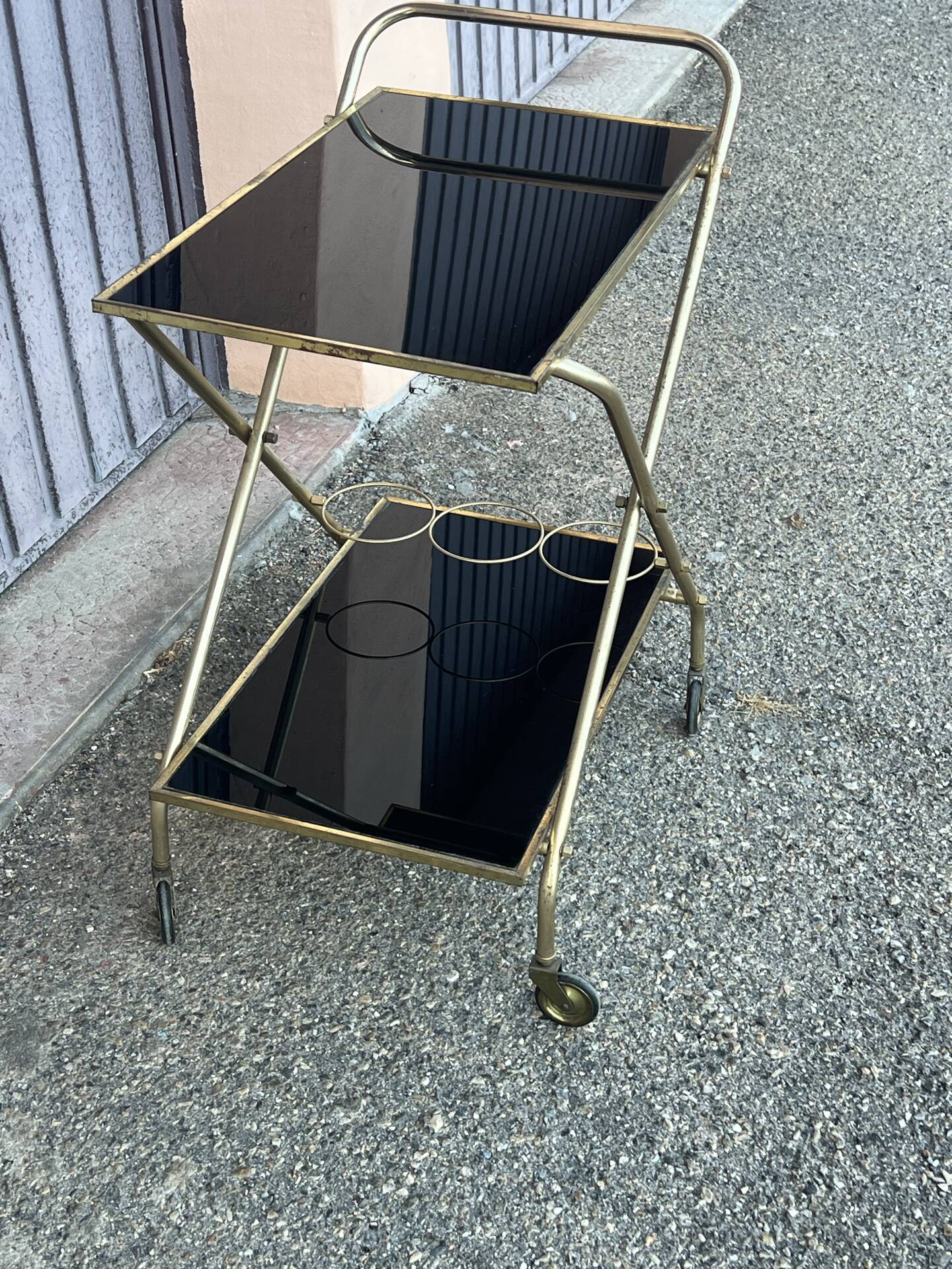 Vintage gold dessert bar with two black trays.