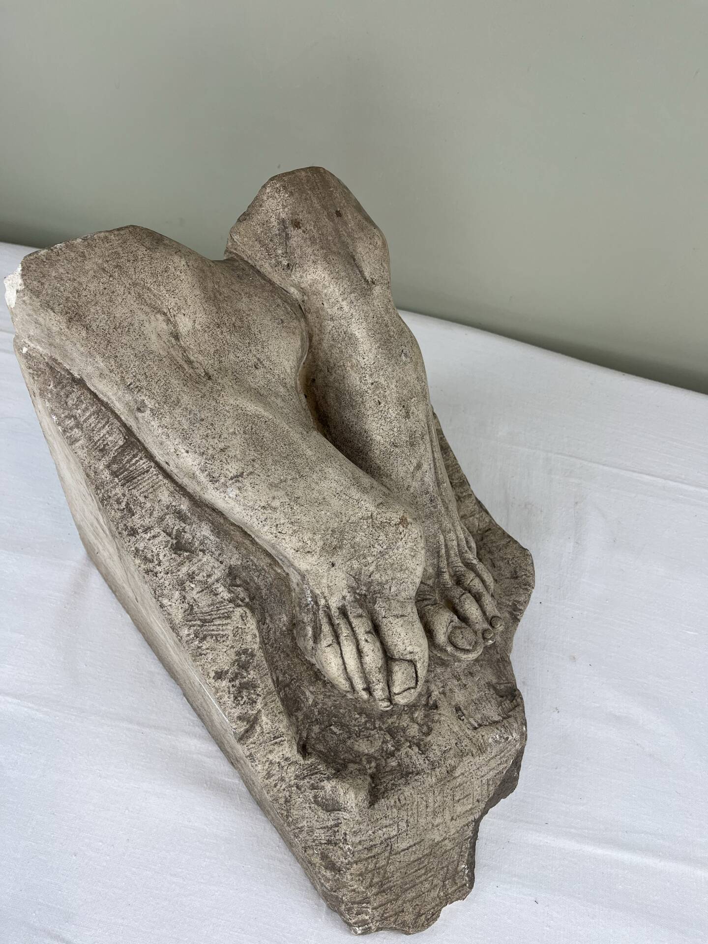 Stone sculpture, two feet on a block, signed D. Paillot.