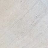 Square table in softened travertine by Berraldacci Design Collection