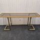 Vintage brass and smoked glass console.