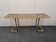 Vintage brass and smoked glass console.