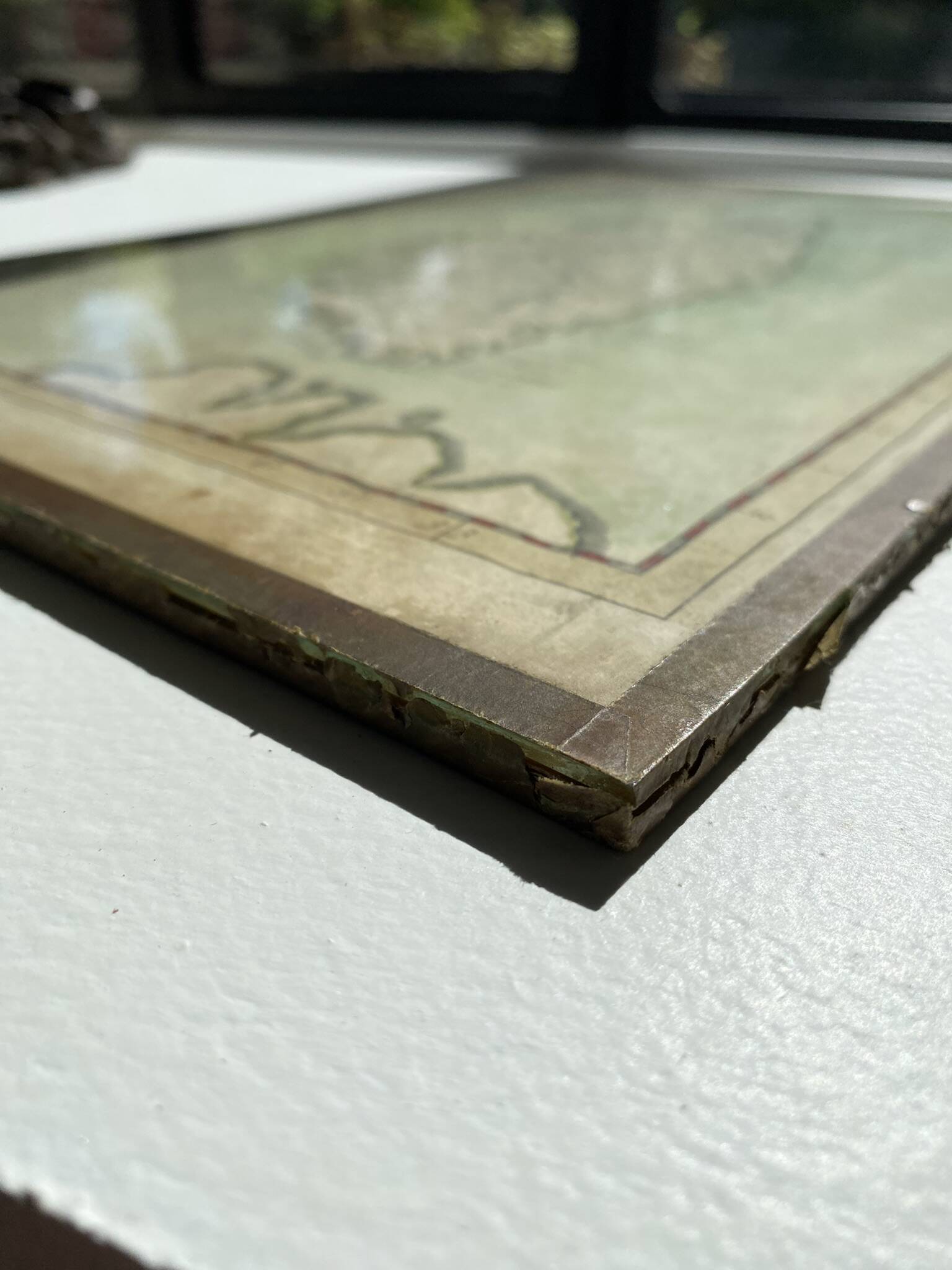 Old map of the Isle of Corsica framed under glass