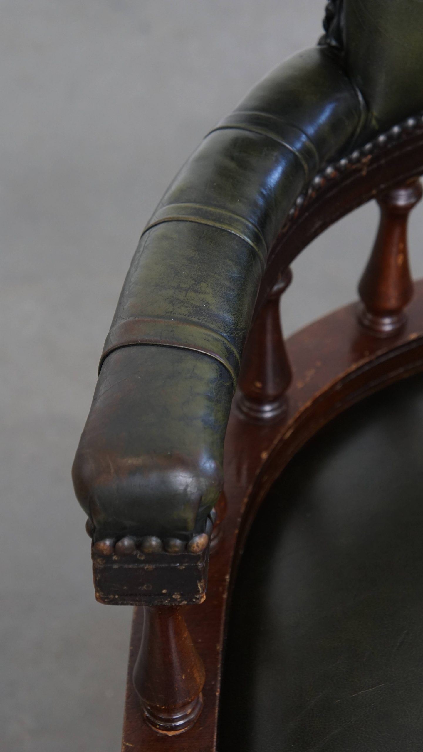 Adjustable green leather and wood Chesterfield office chair with swivel