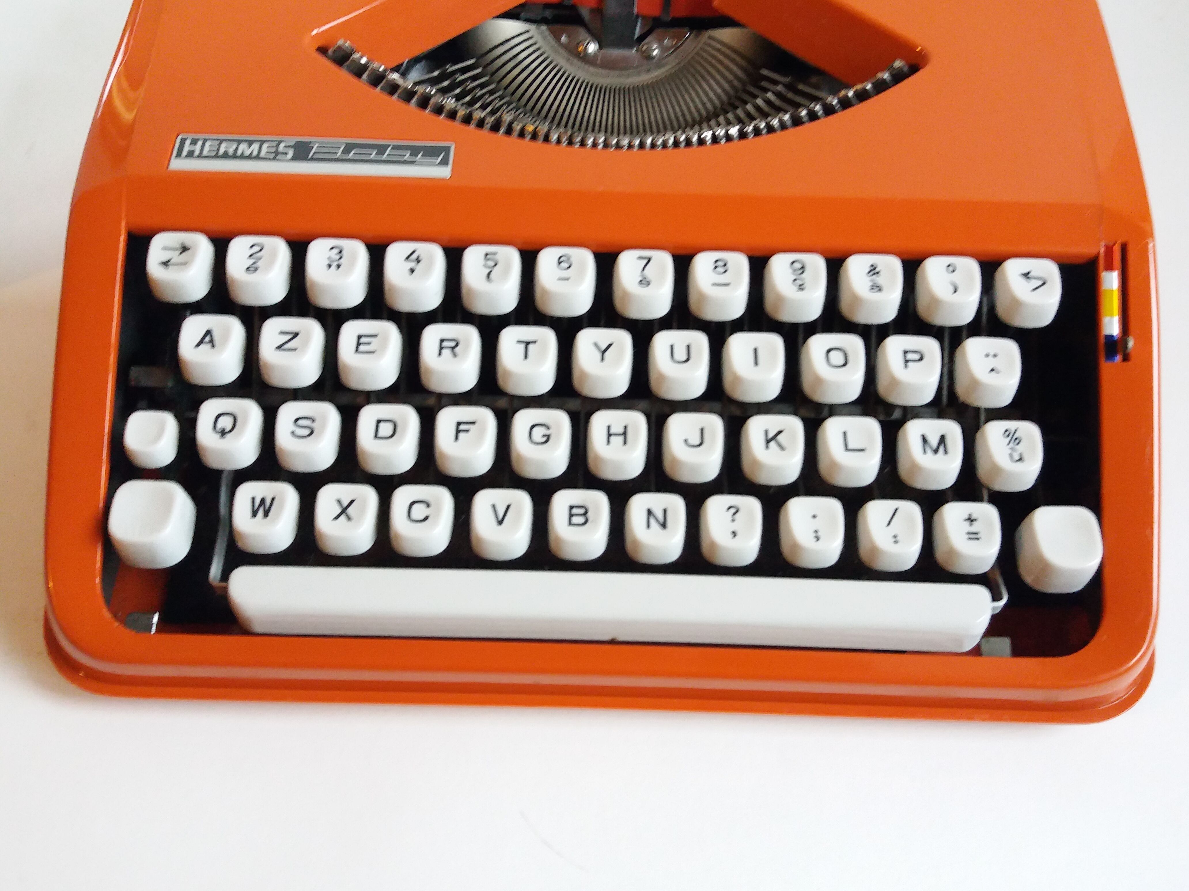 Hermes Baby orange typewriter
