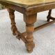 Vintage 70s coffee table with wood and ceramic tiles featuring bird and nature patterns.