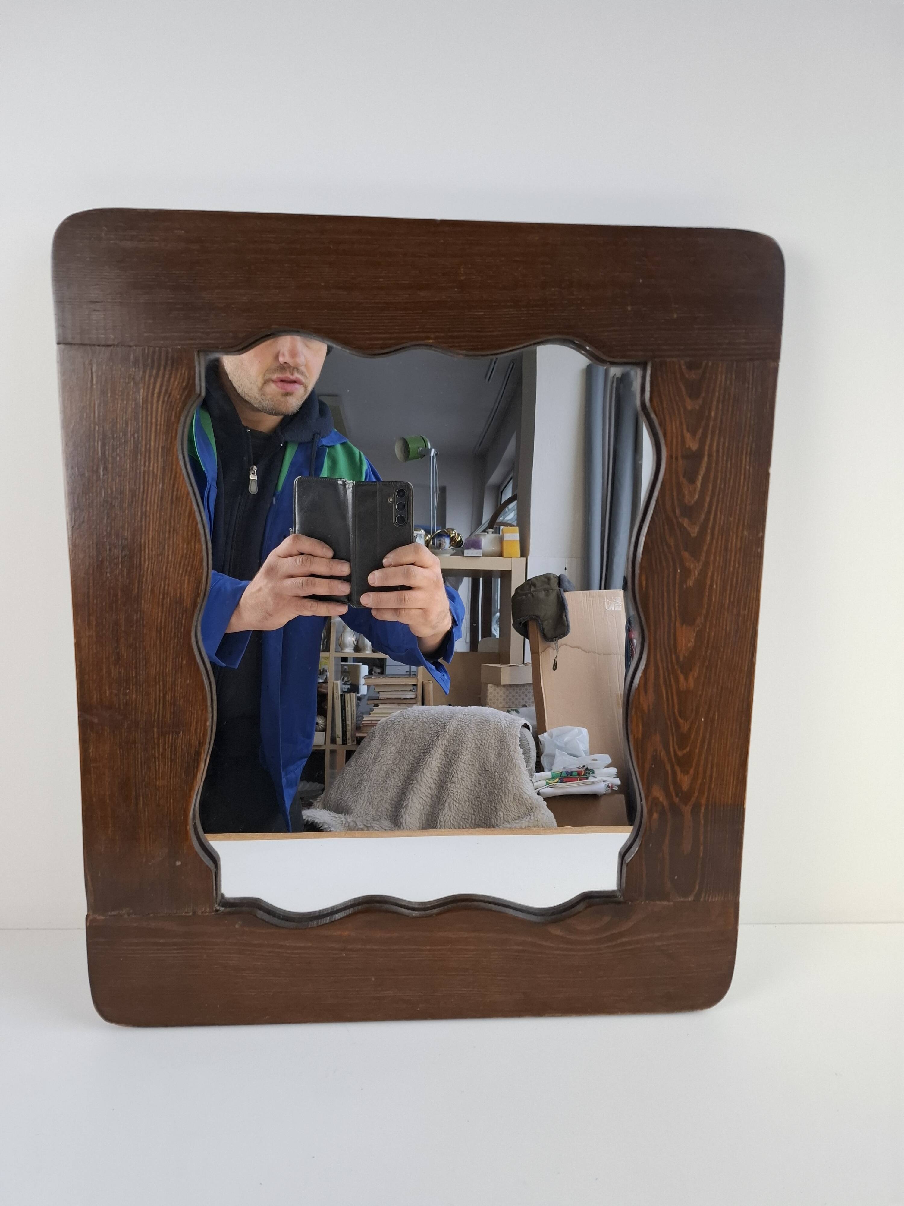 Czechoslovakian wall mirror with a wavy wooden frame, mid-century, 1940s