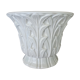 Important white earthenware pot cache with leafy decoration