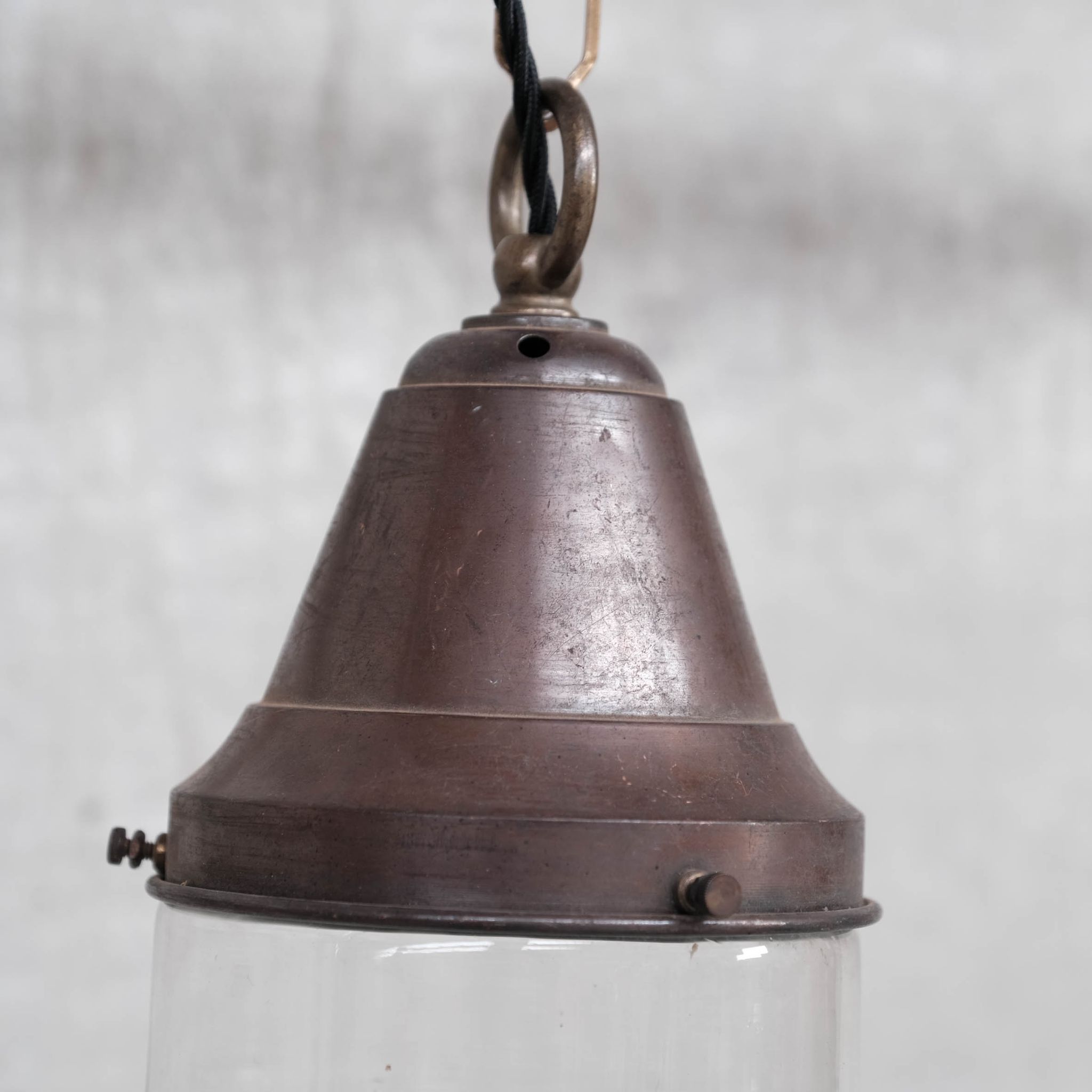 Pair of brass and clear glass industrial pendants