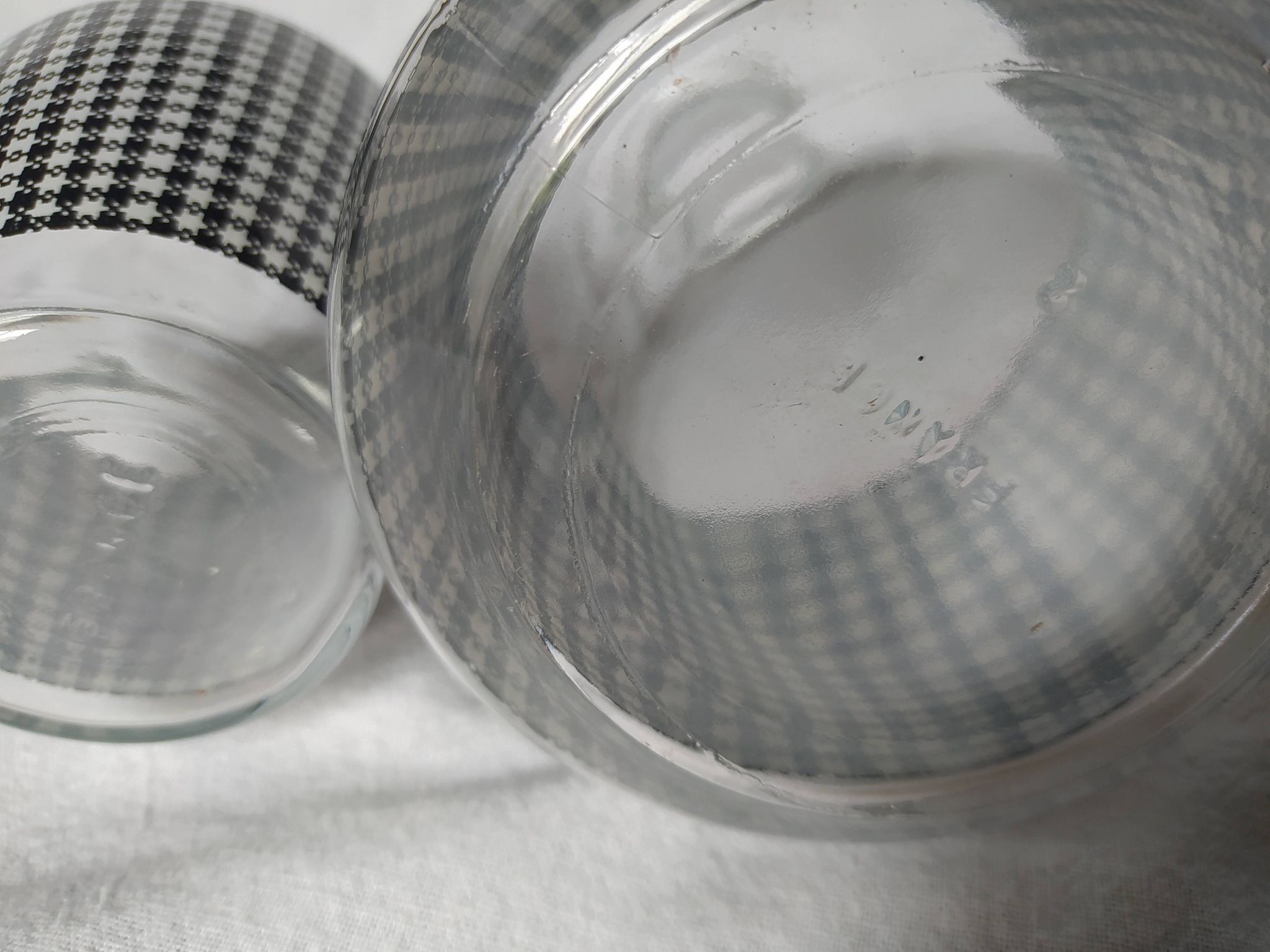 Set of 2 black and white houndstooth glass carafes from the Arques crystal factory. Rare.
