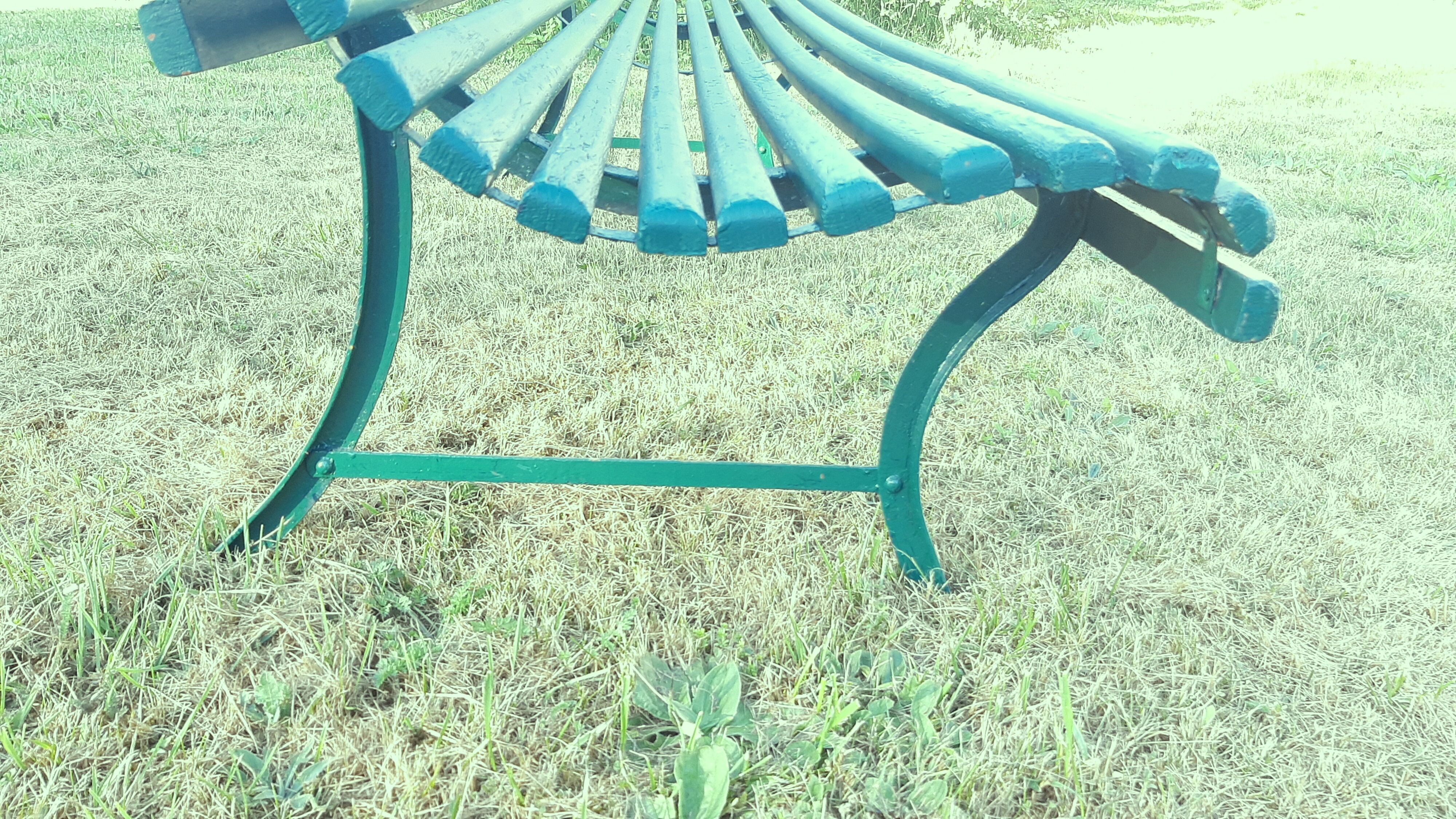 Garden bench with wooden and iron slats