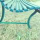 Garden bench with wooden and iron slats