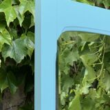 Beveled mirror on turquoise Parisian door