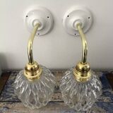 Pair of chiseled glass wall sconces