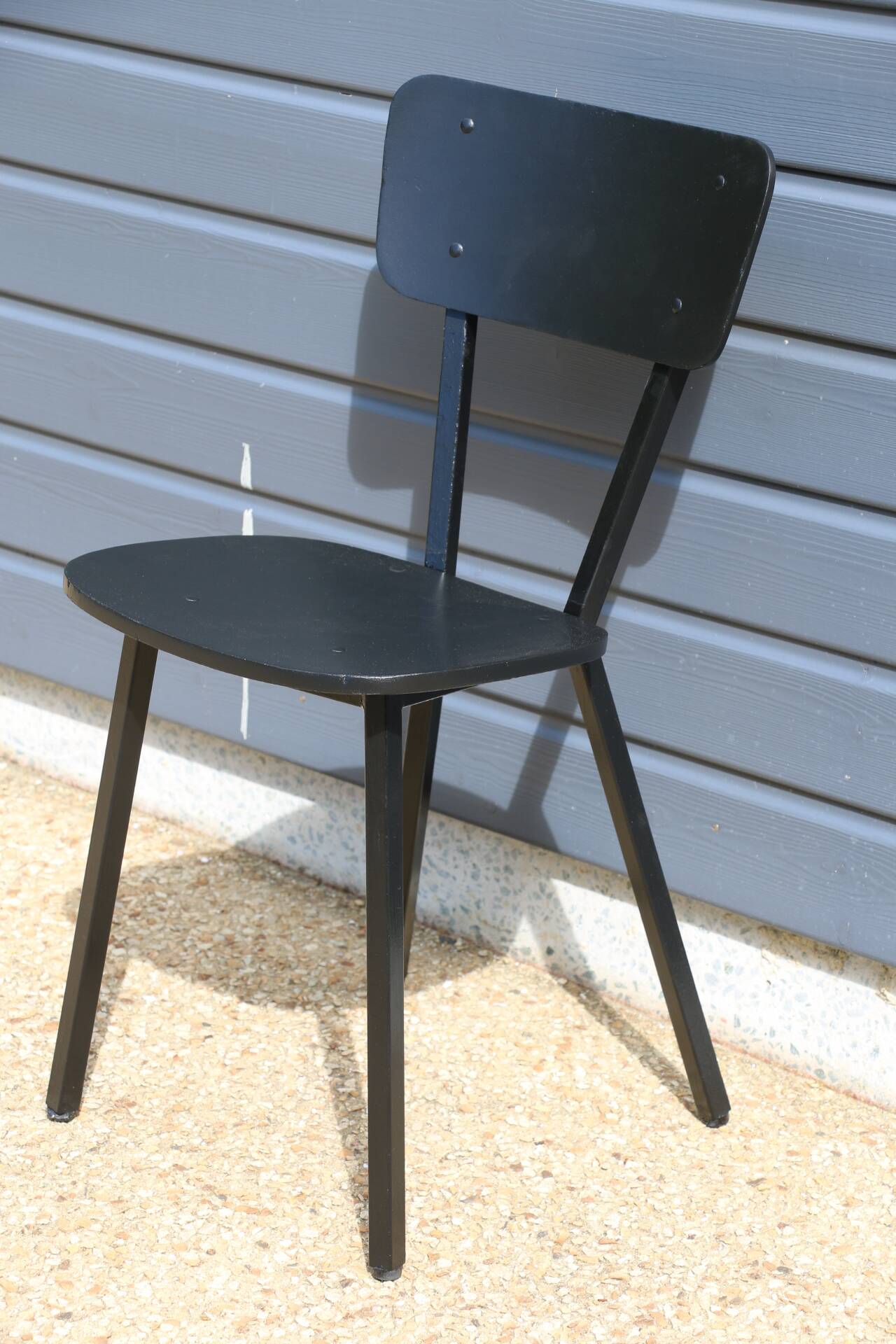 4 black metal and wood chairs