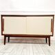 Mid-century teak sideboard with white synthetic doors.