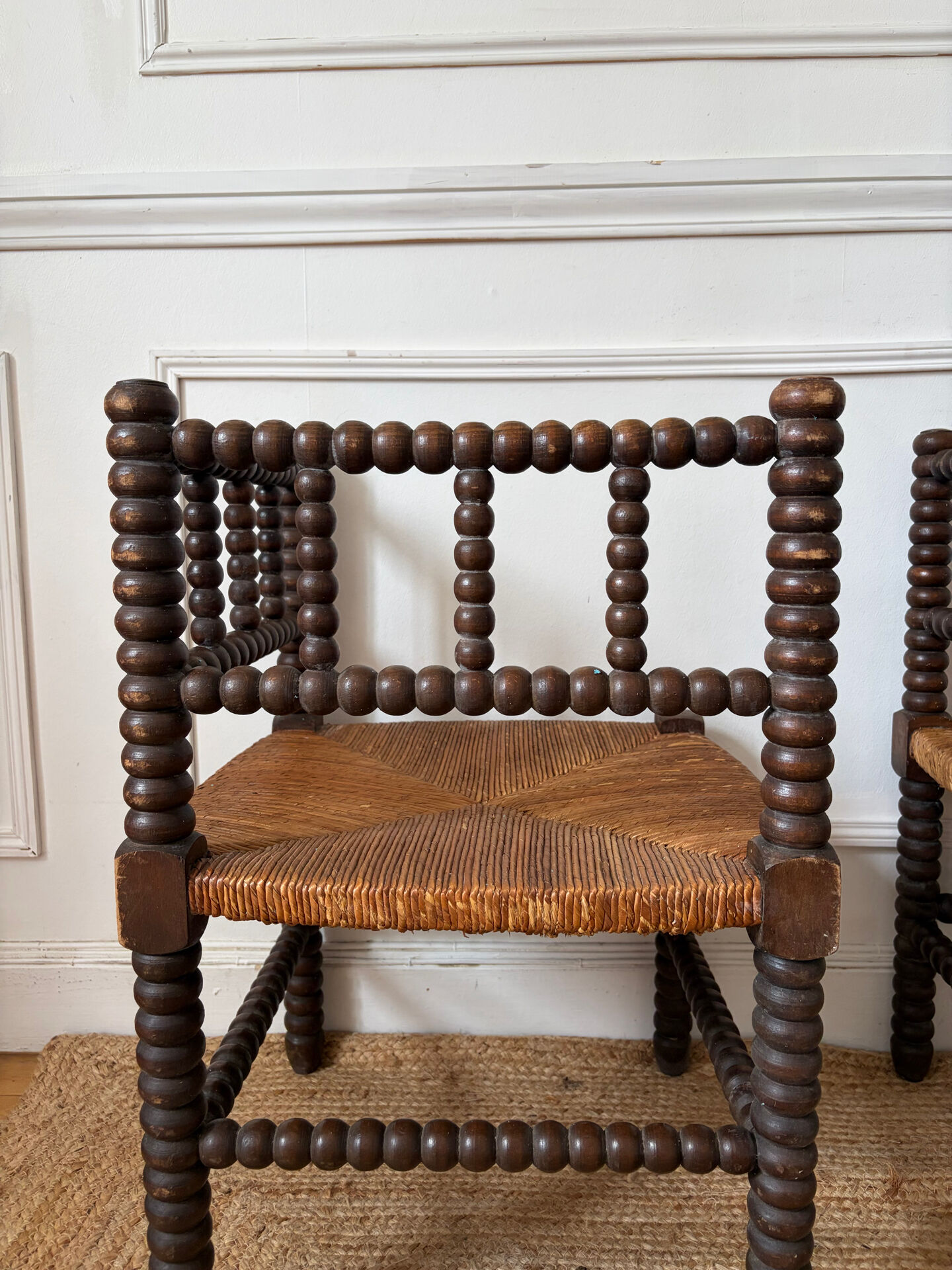 Pair of rush-seated chairs by the fireside "bobbin"