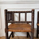 Pair of rush-seated chairs by the fireside "bobbin"