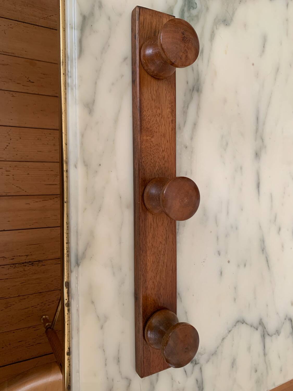 Wooden wall-mounted coat rack