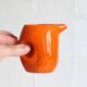Petit pichet en céramique orange des années 70