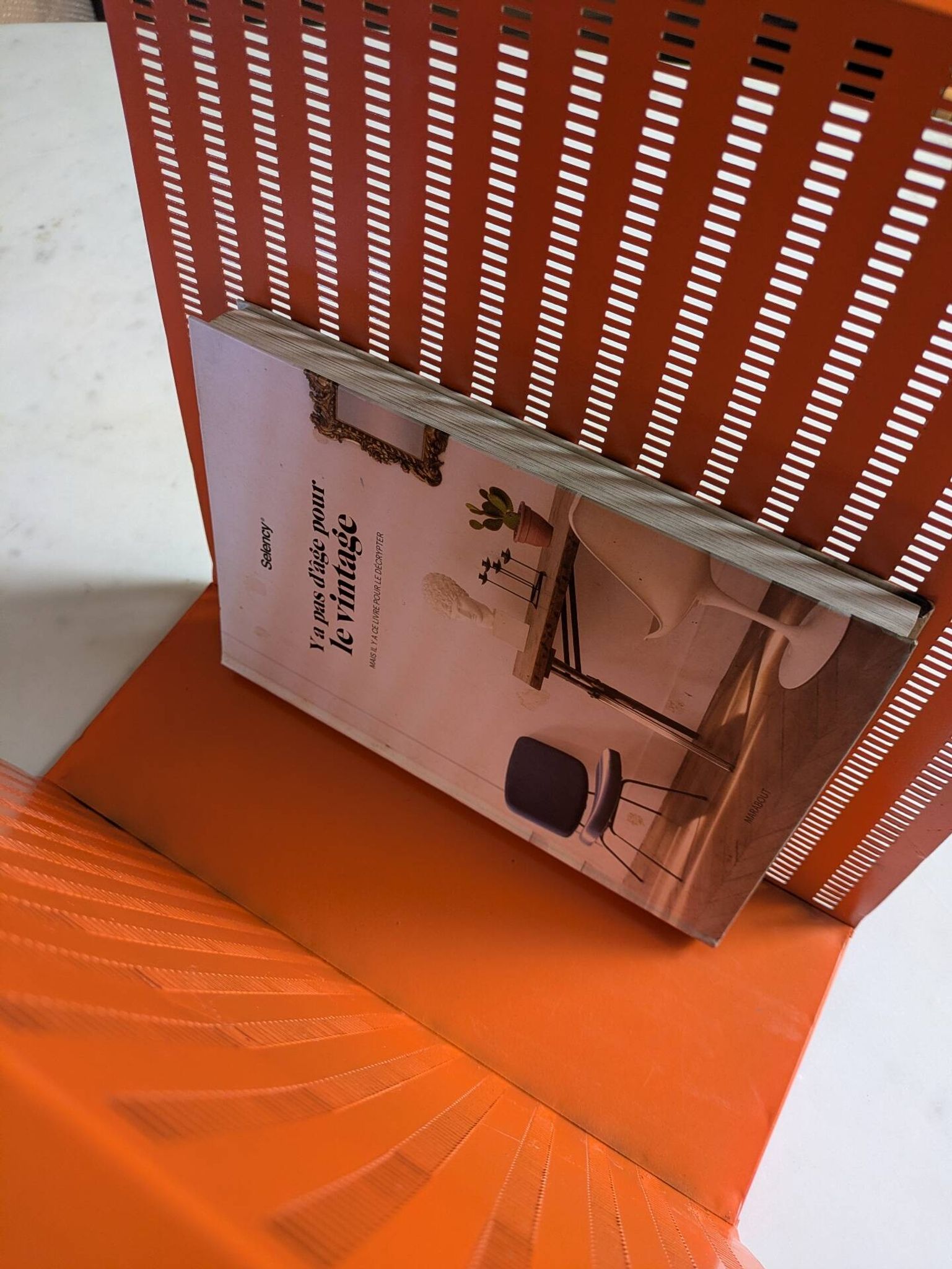 Vintage metal magazine rack in perforated orange/Mathieu Mategot style/70s