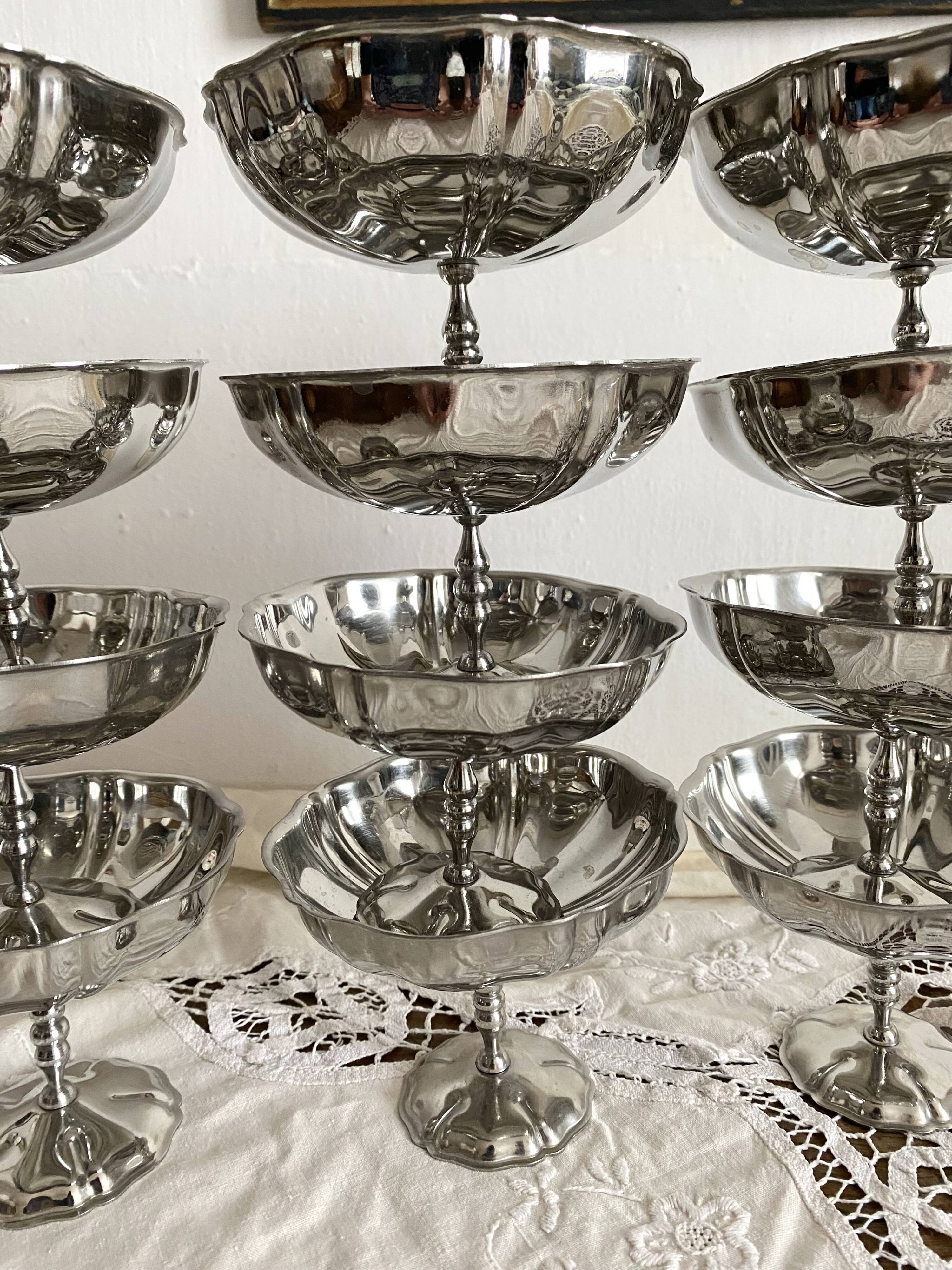 Vintage stainless steel cups on foot