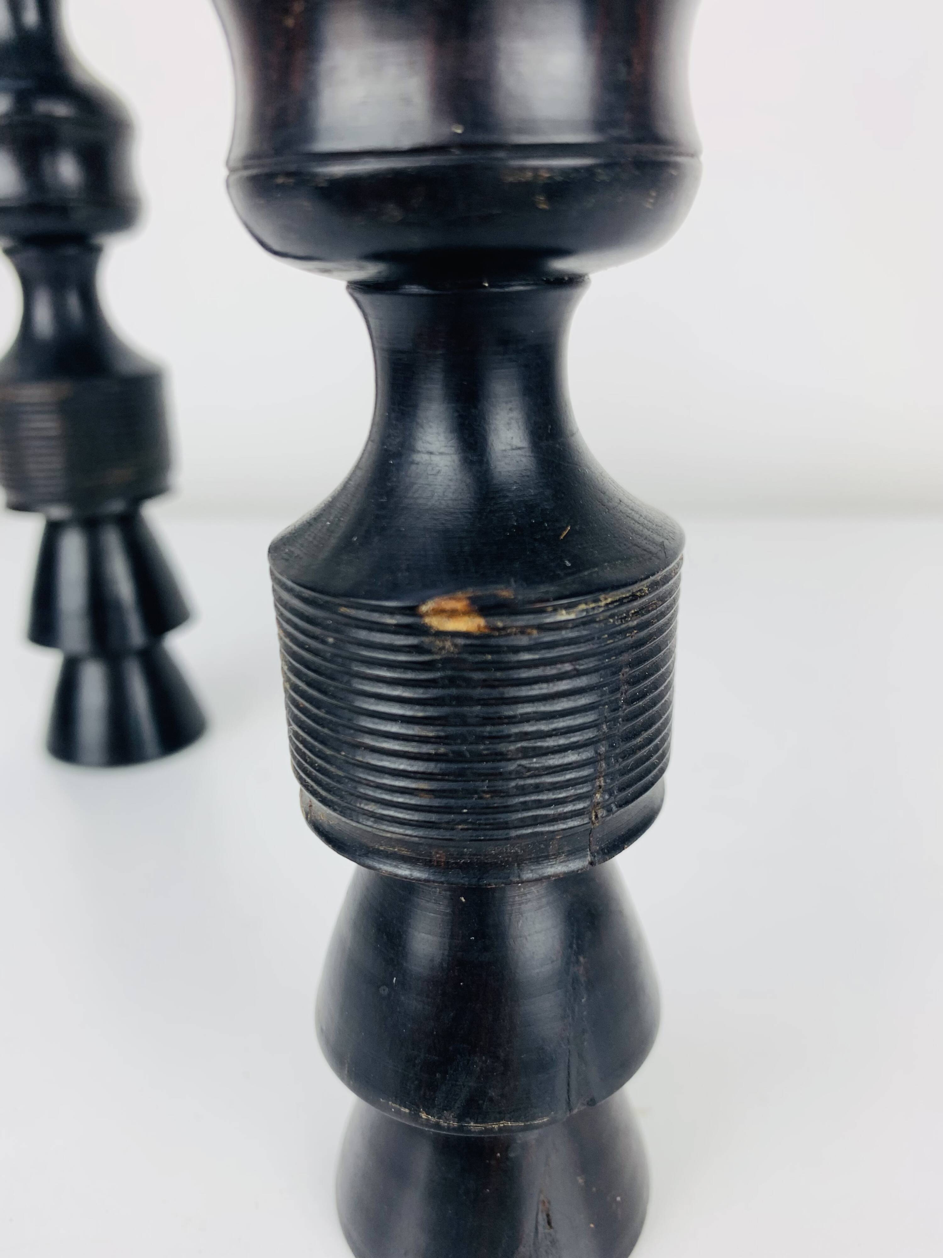Pair of vintage ethnic blackened wood candlesticks