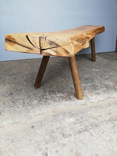 Big bench in solid rough wood very thick Brutalism