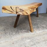 Big bench in solid rough wood very thick Brutalism