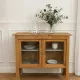 Art Deco sideboard in raw wood with a wax finish, closed by 2 glass doors.