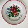 Eastern earthenware plate from the mid-19th century with a hollow rose design.