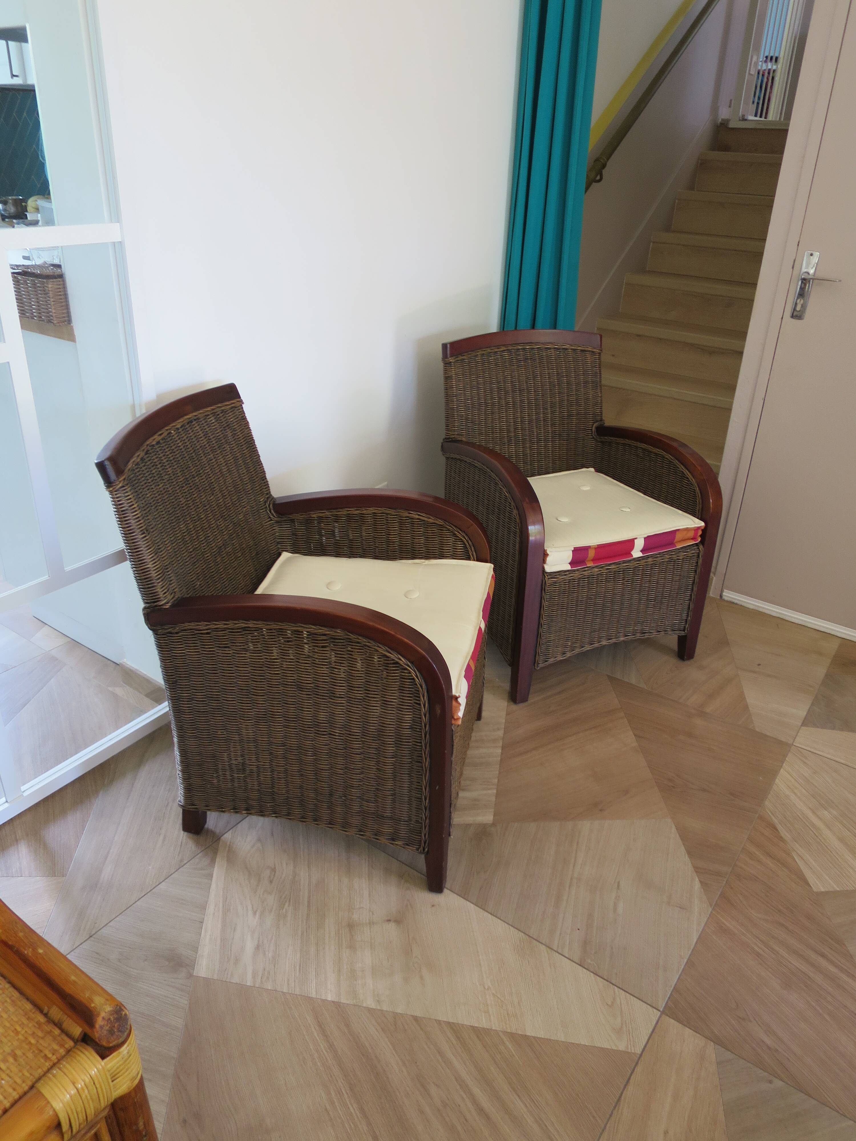 2 armchairs in woven rattan and wood, 1980s