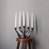 Vintage bronze candlestick chandelier in contemporary Scandinavian design.