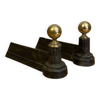 Pair of Napoleon III andirons from the 19th century in cast iron and brass