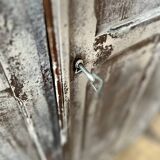 Large Parisian oak wardrobe from the early 20th century with an antique white patina