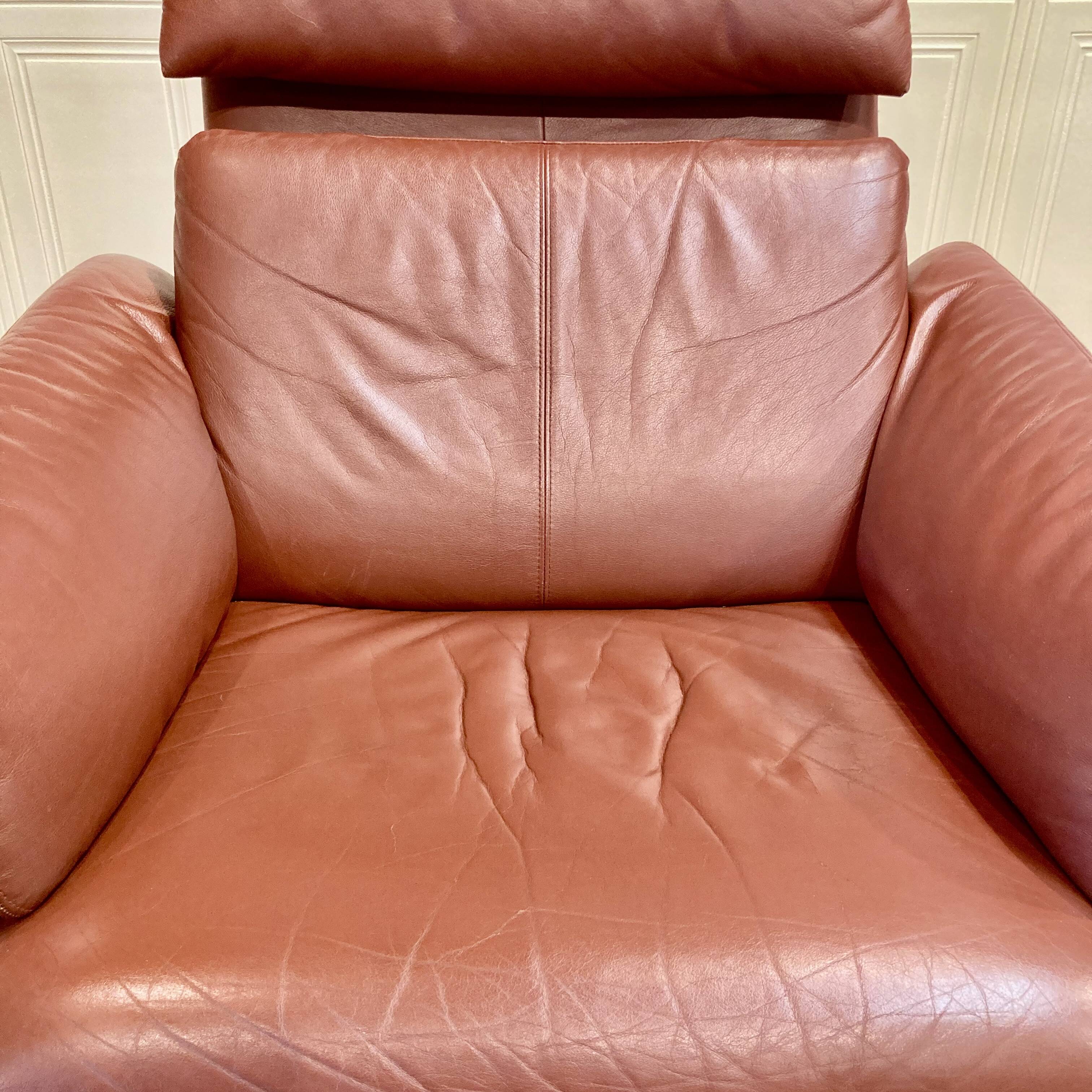 Pair of "Erpo" designer adjustable leather armchairs.
