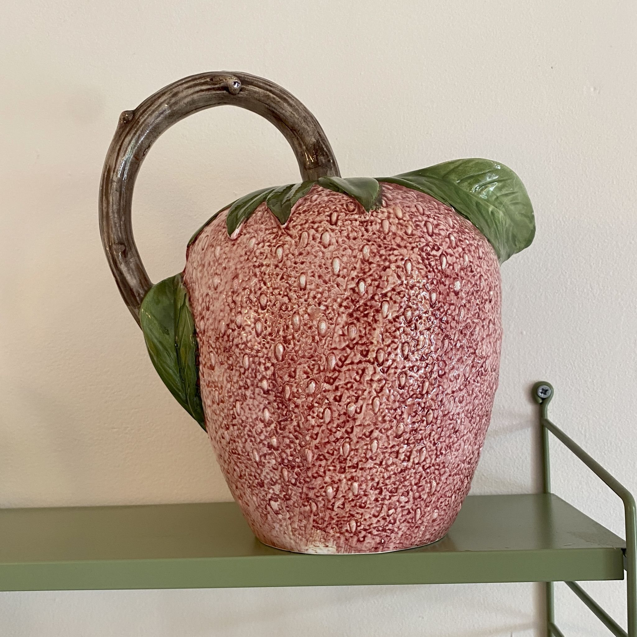 Set of ceramic fruits, a strawberry decanter and two lemon and pineapple jam jars
