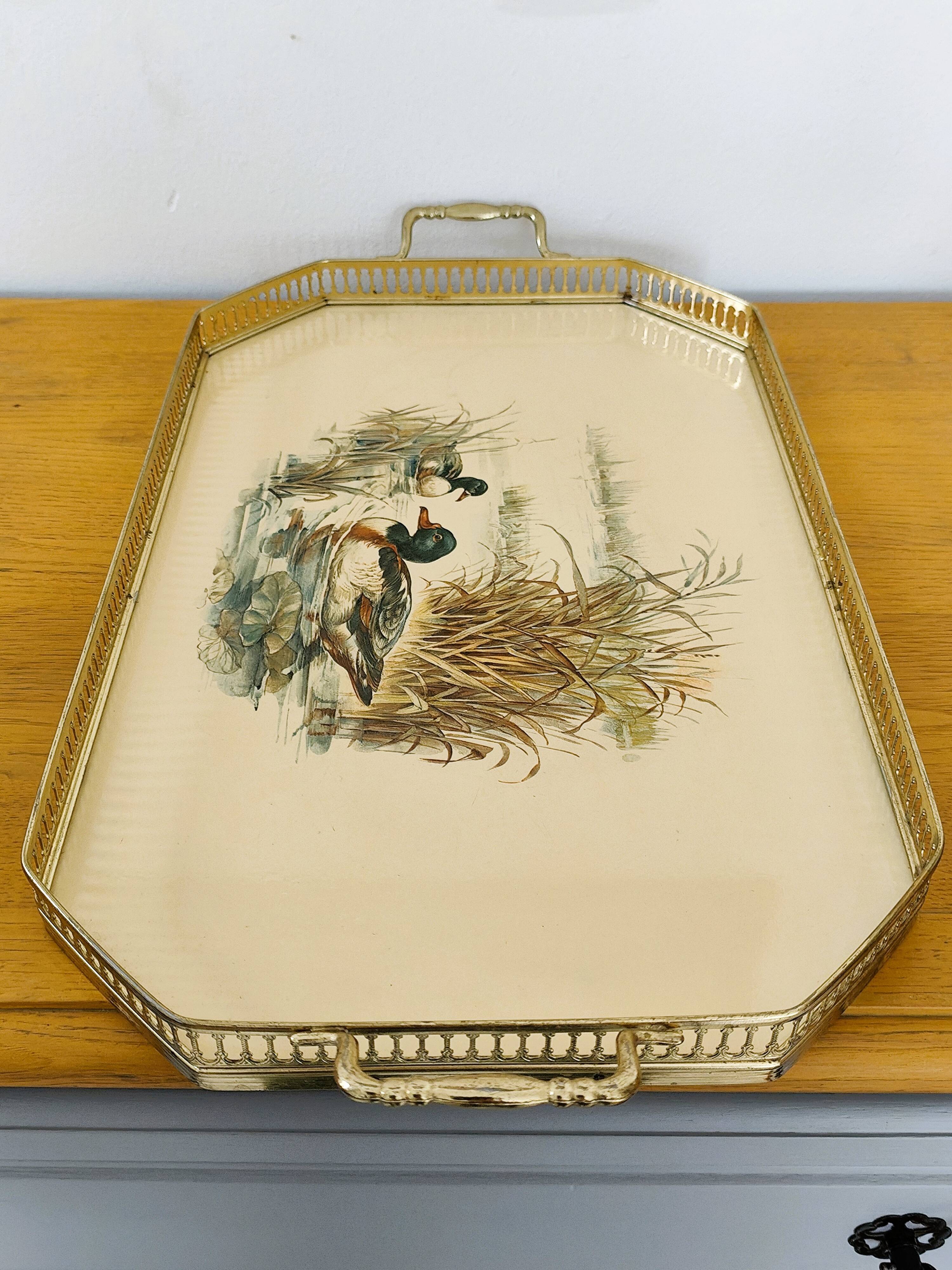 Vintage service tray with a golden gallery and mirror, decorated with ducks.