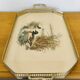 Vintage service tray with a golden gallery and mirror, decorated with ducks.