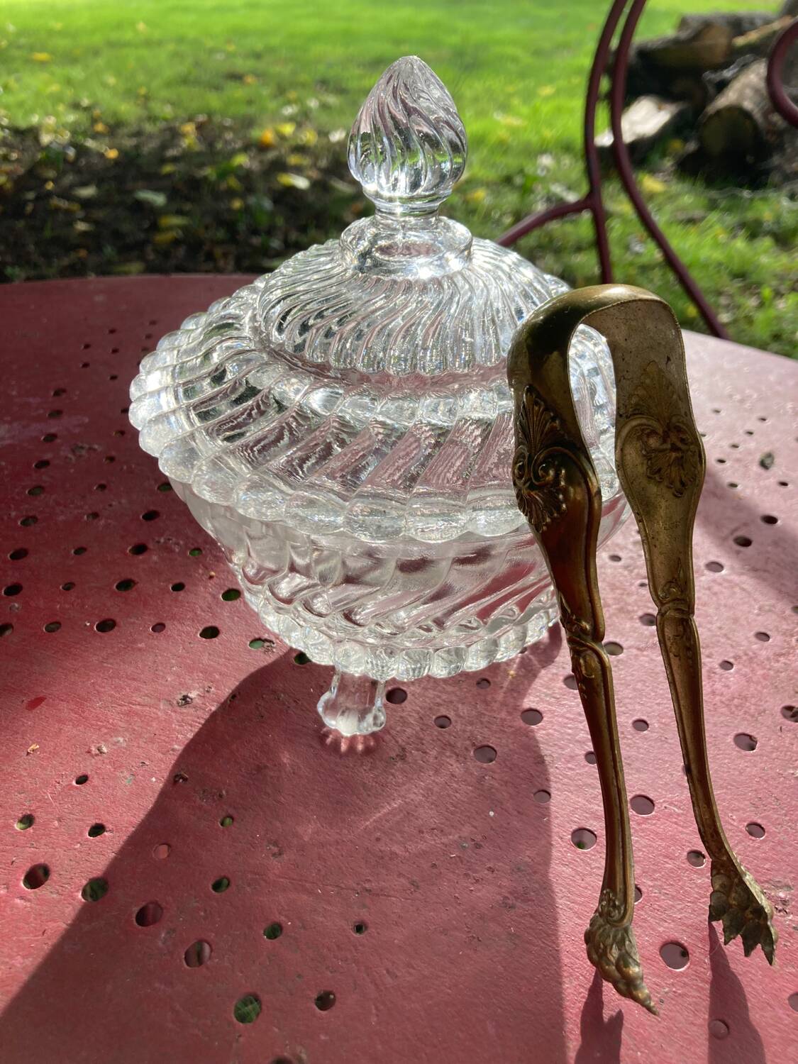 Glass sugar bowl and brass tongs