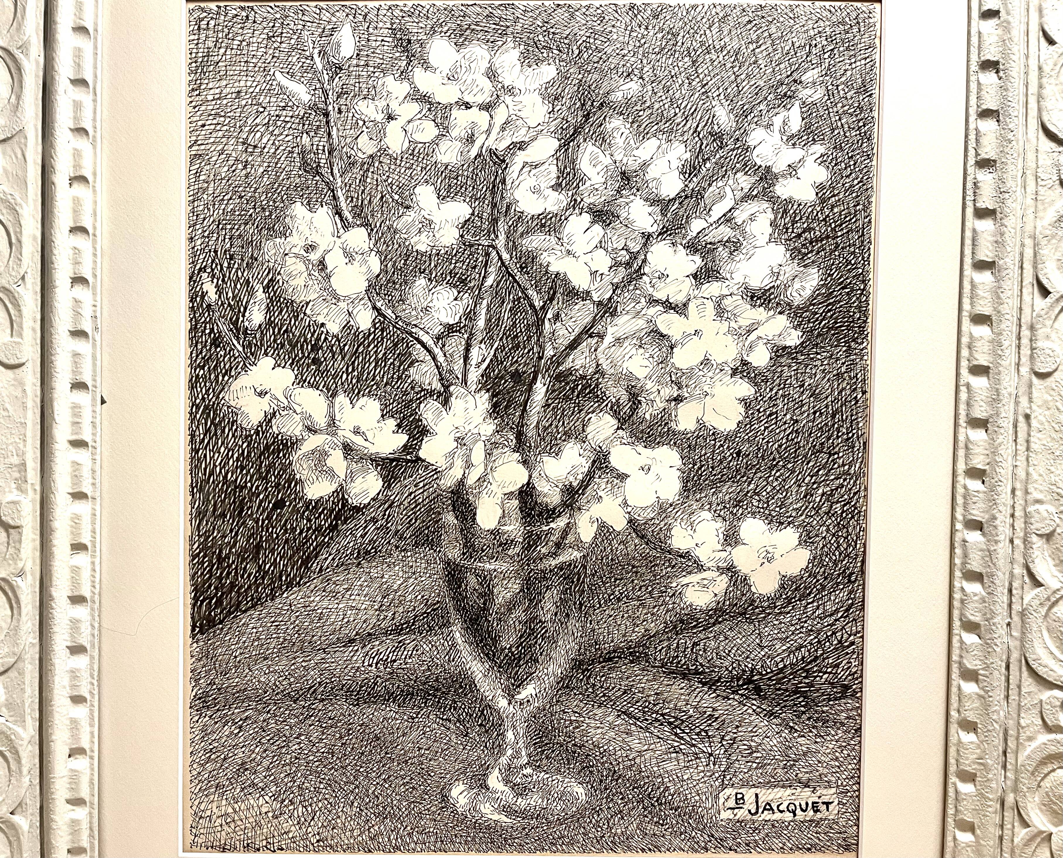 Almond branches in bloom in a glass of water