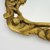 Old wall mirror in wood and gilded stucco with shell decoration, Louis XV style pediment mirror