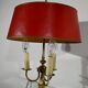 Brass bouillotte lamp with red lampshade, Louis XVI – XXth style